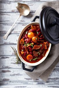 Beef goulash with mushrooms and vegetables (seen from above)